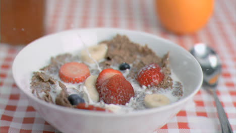 Strawberry-falling-in-super-slow-motion-in-cereal-bowl