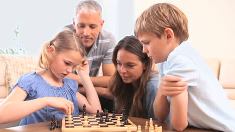 Family-playing-chess