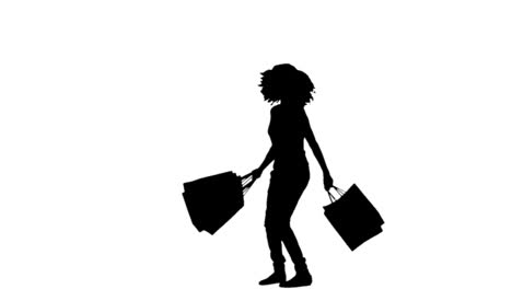 Silhouette-in-slow-motion-holding-shopping-bags