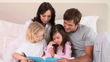 Children-reading-a-book-with-their-parents