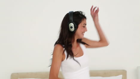 Brunette-haired-woman-dancing-while-listening-to-music