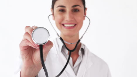 Smiling-doctor-showing-her-stethoscope