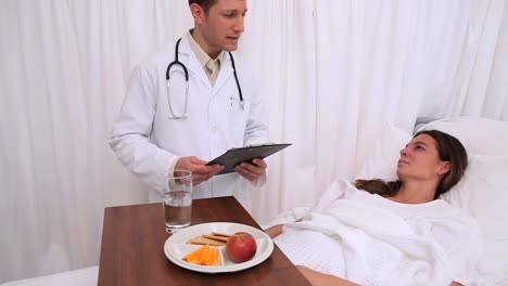 Doctor-standing-next-to-his-patient