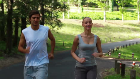 A-couple-jog-together-on-the-road