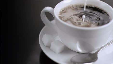 Milk-flowing-in-super-slow-motion-in-a-cup