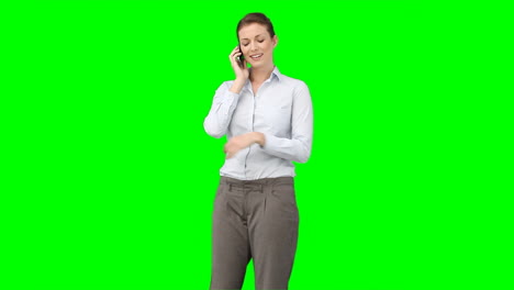 A-business-woman-talks-on-her-mobile-phone