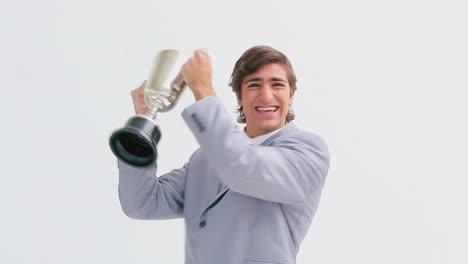 Smiling-man-holding-a-trophy