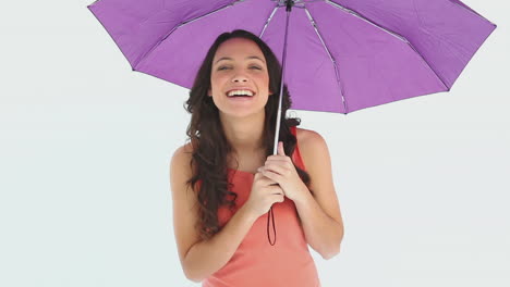 Girls-standing-under-and-holding-an-open-umbrella