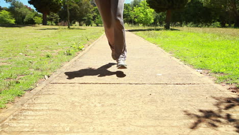 A-low-angle-video-of-a-woman-running-down-towards-the-camera