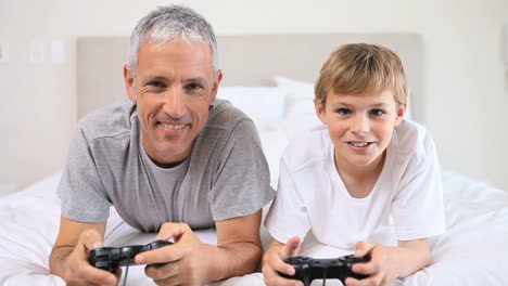 Father-and-son-playing-video-games-together