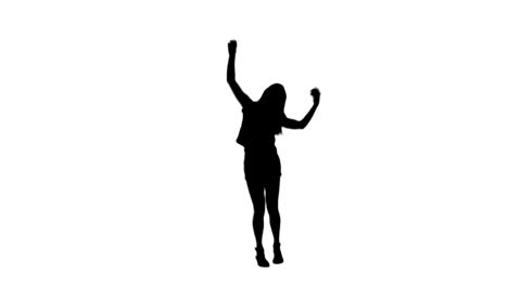 Silhouette-woman-jumping-with-her-arms-raised