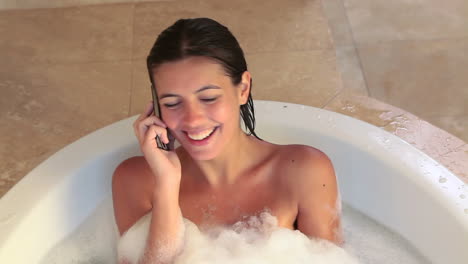 Woman-taking-a-bath-while-calling