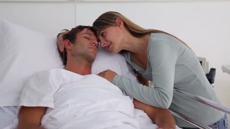 Woman-embracing-her-unconscious-husband