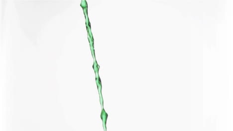 Green-liquid-in-a-super-slow-motion-flowing-continuously-