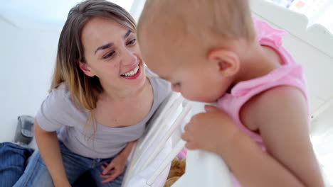 Mother-kissing-her-baby-girl