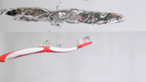 Toothbrush-in-super-slow-motion-falling-in-the-water