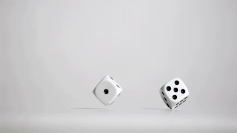 Pair-of-white-dice-in-super-slow-motion-bouncing