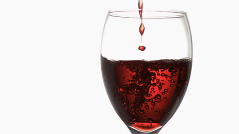 Red-trickle-in-super-slow-motion-flowing-in-a-wineglass-