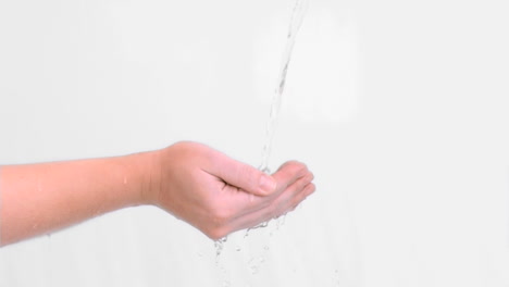 Water-falling-in-super-slow-motion-on-hands