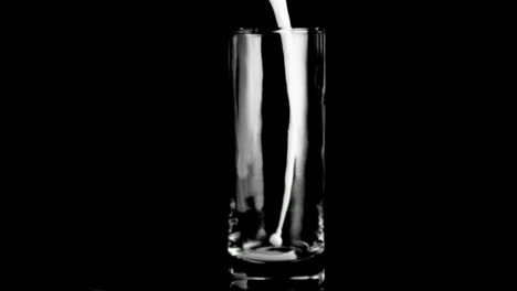 Delicious-milk-in-super-slow-motion-filling-a-glass