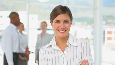 Business-woman-smiling-at-the-camera