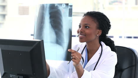 Female-doctor-examining-a-chest-Xray