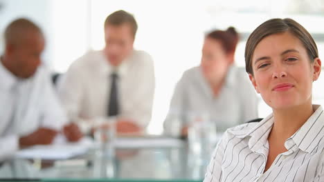 Panning-camera-showing-a-business-woman-smiling