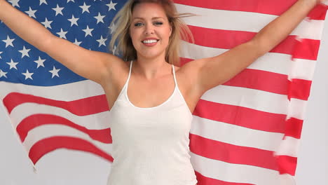Blonde-woman-holding-a-USA-flag