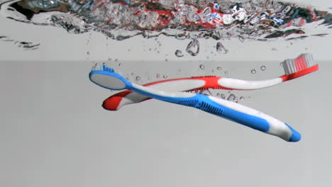 Toothbrushes-in-a-super-slow-motion-falling-