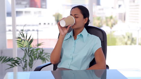 Welldressed-woman-drinking-a-coffee