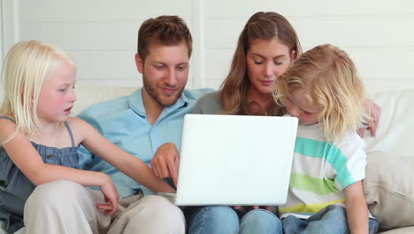 Family-watching-something-on-a-laptop-together