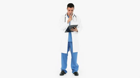 Doctor-writing-on-a-clipboard
