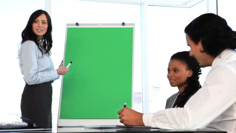 Brunette-businesswoman-making-a-presentation