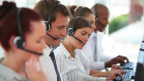 A-large-business-team-wearing-headsets