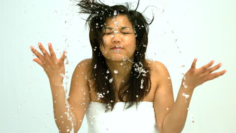Woman-splashing-water-on-her-face