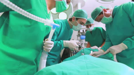 Close-up-of-a-nurse-holding-an-anesthesia-mask