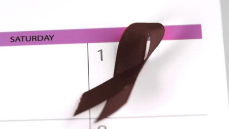 Red-ribbon-symbol-for-Aids-falling-on-a-calendar