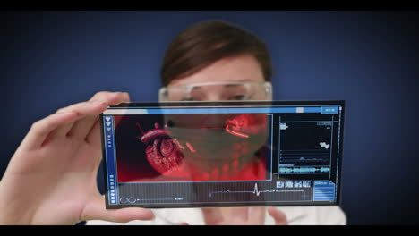 Scientist-scrolling-through-videos-of-human-body-interior