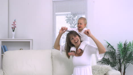 Mother-playing-with-her-child-on-the-shoulders