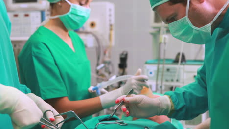 Surgeons-operating-a-patient-in-an-operating-theater