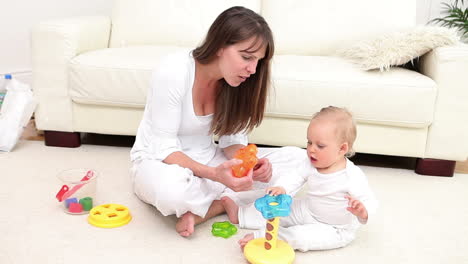 Woman-and-baby-playing-with-a-toy