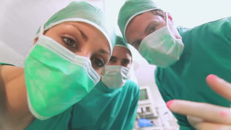 Focus-on-a-surgical-team-taking-off-an-anesthesia-mask
