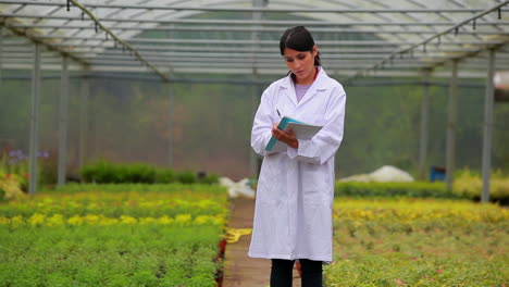 Woman-standing-holding-clipboard