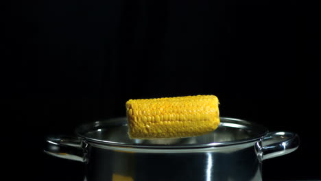 Corn-cob-falling-into-saucepan