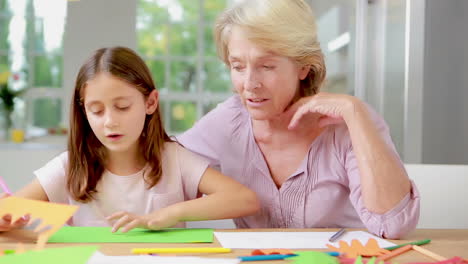 Child-drawing-and-speaking-to-her-grandmother