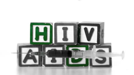 Nadel-Fällt-Vor-Blöcken-Rechtschreibhilfen-Und-HIV