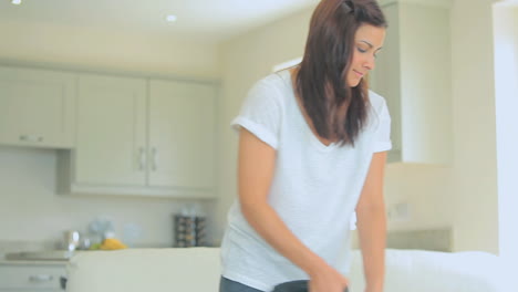 Video-of-woman-standing-at-the-living-room-hoovering-
