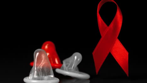 Condoms-falling-down-in-front-of-a-red-ribbon-