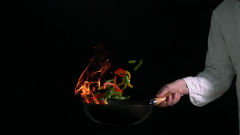 Peppers-burning-in-a-pan-with-little-flame