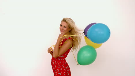 Woman-holding-colored-balloons-
